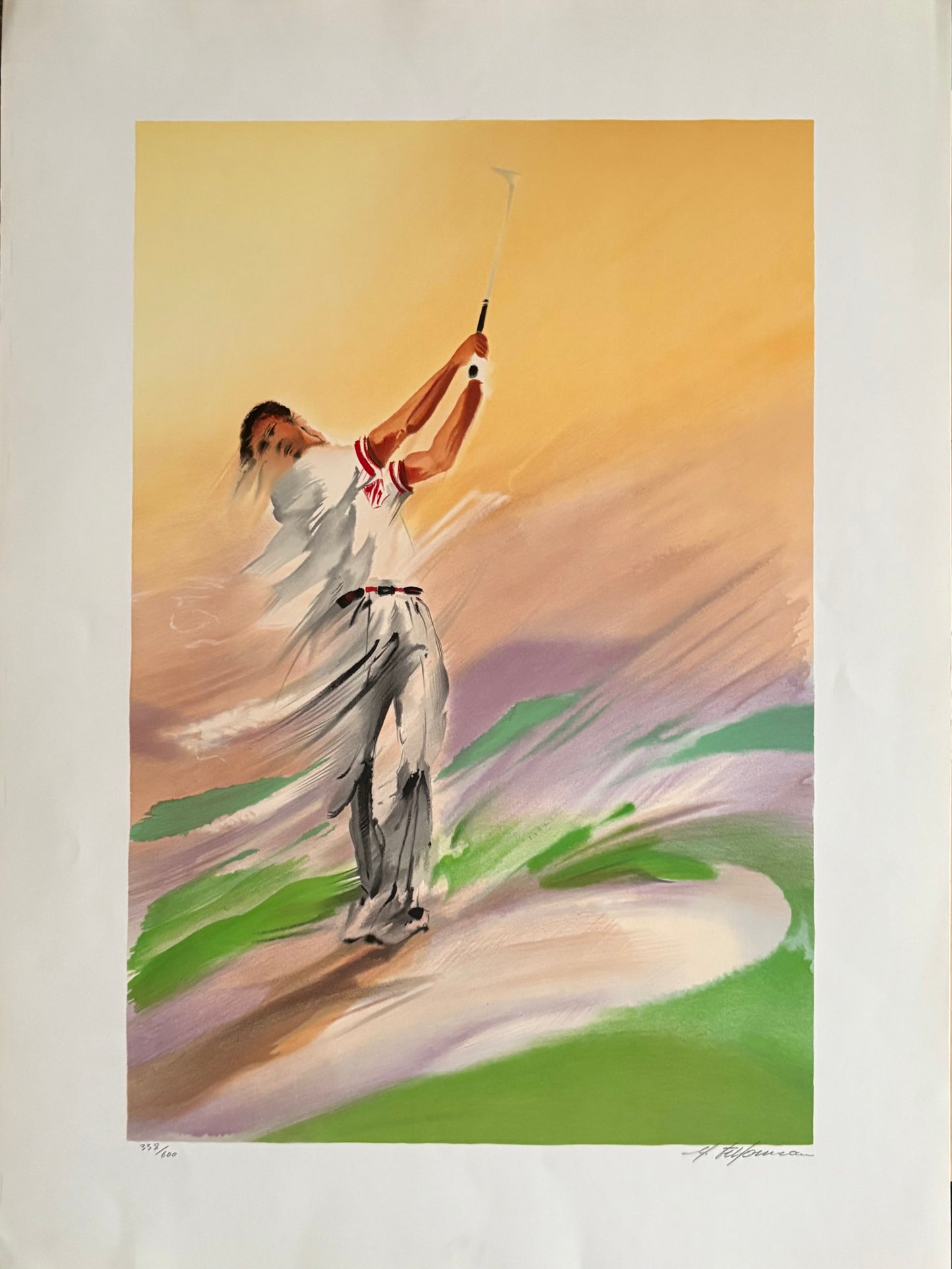 Unframed and matted lithograph of a golfer in mid-swing against an abstract multicolored background, signed by Maurice Fillonneau.