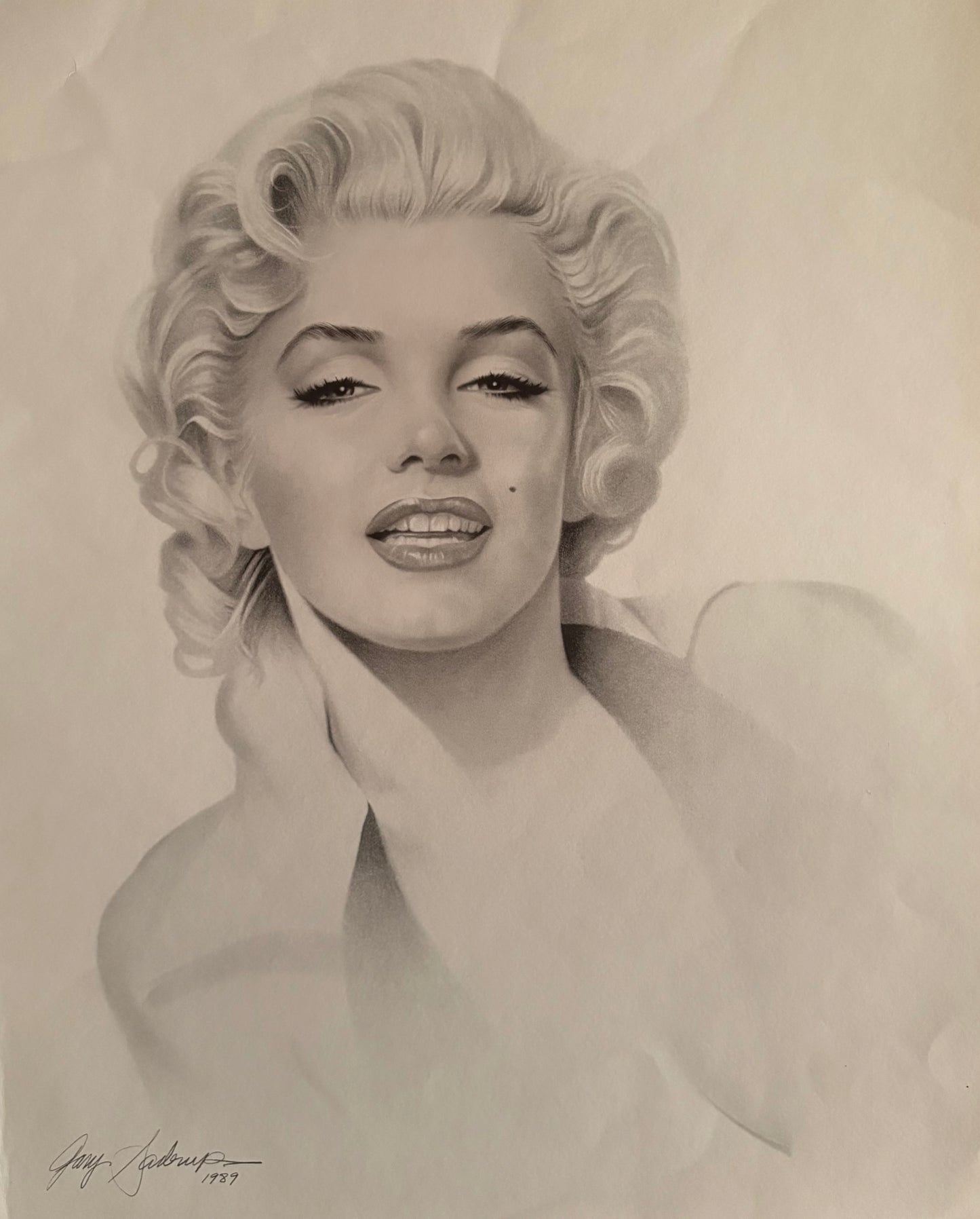 This image features a striking portrait of Marilyn Monroe, artistically rendered by Gary Saderup in 1989. The artwork, measuring 20 x 74 inches, captures Monroe's iconic features in a detailed black and white drawing.